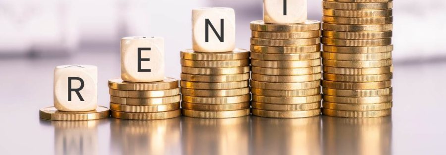 Coraz wyższe stosiki monet z kostkami na szczycie. Kostki układają się w napis RENTA. Napisz Sprawdź artykuł Renta powypadkowa Uniqa